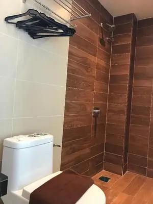 a bathroom with a toilet and a shower at Festival Boutique Hotel - Damai Complex in Kuala Lumpur