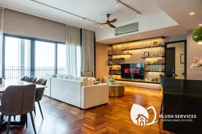 a living room with a couch and a table at The Mews KLCC by Plush in Kuala Lumpur
