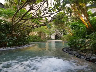 a stream in the middle of a pool of water at The Mews KLCC by Plush in Kuala Lumpur