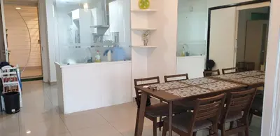 a dining room with a table and chairs at 1room Publika in Kuala Lumpur