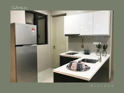 a kitchen with a sink and a refrigerator at KL Gateway Mall - Easy Access to KL Sentral & KLCC in Kuala Lumpur