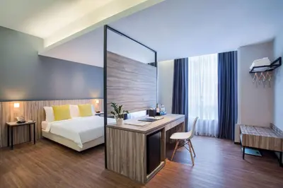 a hotel room with a bed and a desk at Days Hotel & Suites by Wyndham KL - Chan Sow Lin MRT or LRT in Kuala Lumpur