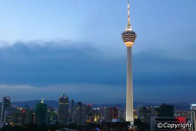 a view of the space needle in a city at night at Perfect Location@ Heart of KL City Centre next to Metro MRT in Kuala Lumpur