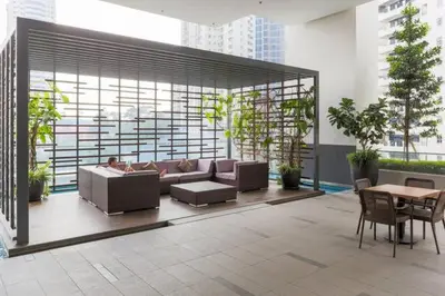 a living room with a couch and a table at Perfect Location#2 @Heart of KL City Centre next to Metro MRT in Kuala Lumpur