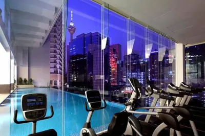 a gym with a view of a city skyline at Perfect Location#2 @Heart of KL City Centre next to Metro MRT in Kuala Lumpur