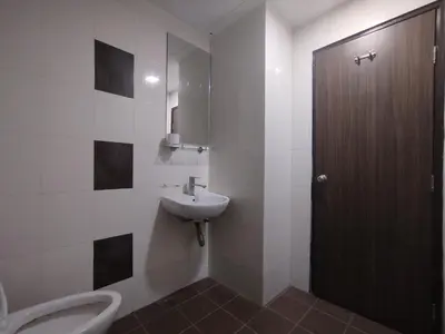 a bathroom with a sink and a toilet at Hotel De Grand Orchard in Kuala Lumpur