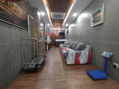 a hallway with a row of couches in a room at Hotel De Grand Orchard in Kuala Lumpur