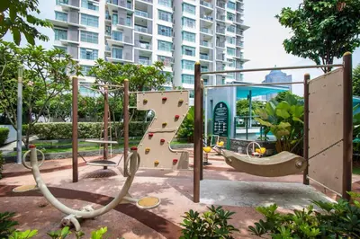 a playground in front of a large building at Suasana Bukit Ceylon by Plush in Kuala Lumpur