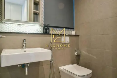 a bathroom with a sink and a toilet and a mirror at Maxhome at Lucentia Bukit Bintang City centre KL in Kuala Lumpur