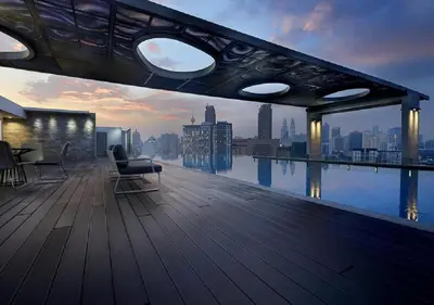 a balcony of a building with a view of the city at Maxhome @ D'Majestic Place, KL City Centre in Kuala Lumpur