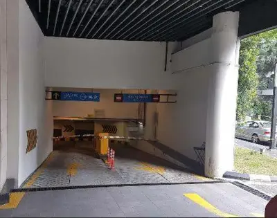 a building with a parking lot with a parking garage at Avenue K in Kuala Lumpur