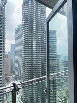 a view of a large building from a window at Avenue K in Kuala Lumpur