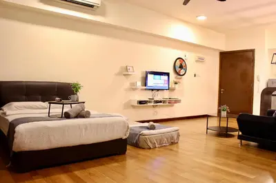 a bedroom with a bed and a flat screen tv at ✦Time & Traveller✦Regalia Suites and Residence✦KLCC view Infinity Pool✦双子塔无边泳池 in Kuala Lumpur