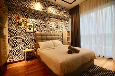 a bedroom with a bed with a teddy bear on it at ✦Time & Traveller✦Regalia Suites and Residence✦KLCC view Infinity Pool✦双子塔无边泳池 in Kuala Lumpur