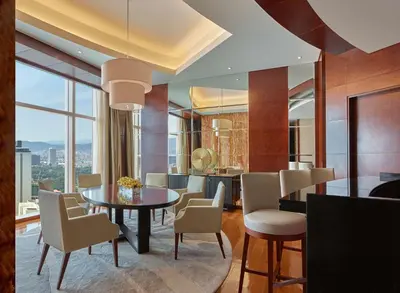 a dining room with a table and chairs at Grand Hyatt Kuala Lumpur in Kuala Lumpur