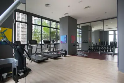 a gym with treadmills and cardio equipment in a building at KLCC The Mews Home in Kuala Lumpur