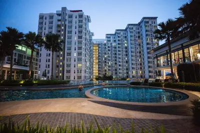 a pool in the middle of a city with tall buildings at Velocity KL By PSM Luxury Suites in Kuala Lumpur
