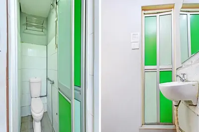 a bathroom with a toilet and a sink at Hotel O Elwarda Klcity in Kuala Lumpur