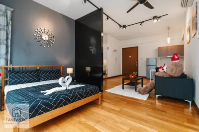 a bedroom with a bed with two swans on it at Regalia Residence by FANTASTIC in Kuala Lumpur