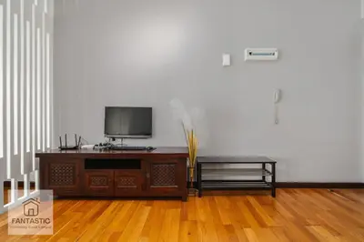 a living room with a flat screen tv on a table at Regalia Residence by FANTASTIC in Kuala Lumpur