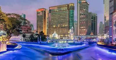 a river in a city with many tall buildings at AnCasa Hotel Kuala Lumpur, Chinatown in Kuala Lumpur