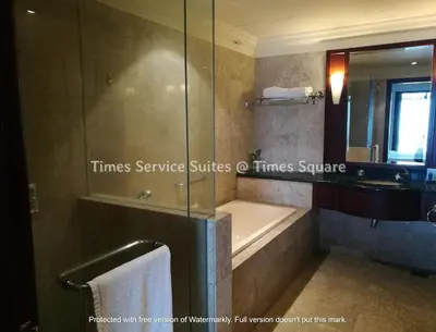 a bathroom with a bath tub and a sink at Times Service Suites @ Times Square in Kuala Lumpur