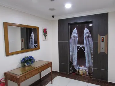 a room with a picture of the burj khalifa at Safari Hotel in Kuala Lumpur