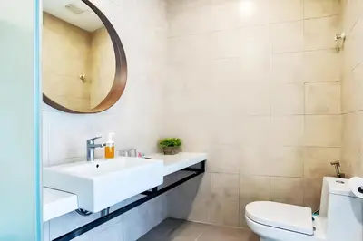 a bathroom with a sink and a toilet at The Robertson Bukit Bintang in Kuala Lumpur