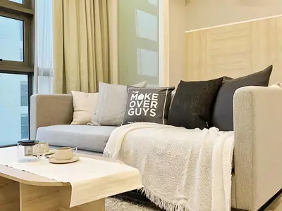 a living room with a couch and a coffee table at The Robertson Bukit Bintang in Kuala Lumpur