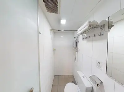 a small bathroom with a toilet and a sink at Hotel O Crossroads Hotel in Kuala Lumpur
