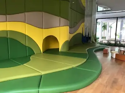 a room with a large wall with a play floor at Velocity Residence in Kuala Lumpur