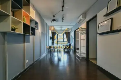 a hallway with a table and chairs in a room at Velocity Residence in Kuala Lumpur