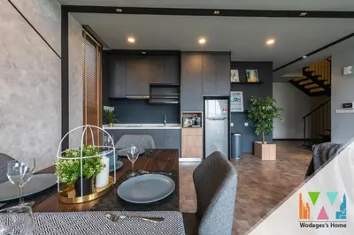 a kitchen and dining room with a table and chairs at Expressionz Suites near KLCC, IJN by Wodages in Kuala Lumpur