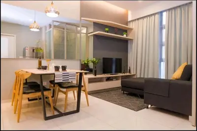 a living room with a table and a couch at The Robertson Bukit Bintang by Wowhome in Kuala Lumpur