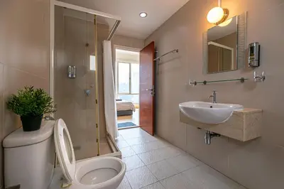 a bathroom with a toilet and a sink at Rex Ollie @ 231 TR Suite in Kuala Lumpur