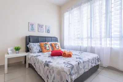 a bedroom with a bed with orange pillows and a window at PV21 Setapak, Share House Room Only in Kuala Lumpur