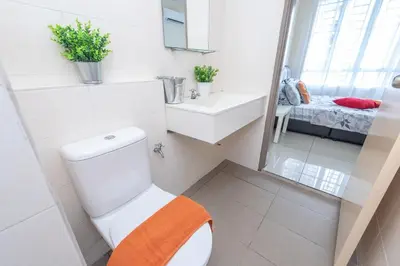 a bathroom with a toilet and a sink and a mirror at PV21 Setapak, Share House Room Only in Kuala Lumpur