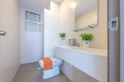 a bathroom with a toilet and a sink and a mirror at PV21 Setapak, Share House Room Only in Kuala Lumpur