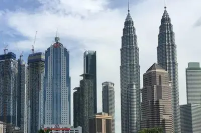 a group of tall buildings in a city at Omar's Place 1 in Kuala Lumpur