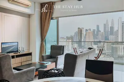 a waiting room with chairs and a large window at Regalia Residence The Sky Pool Suite in Kuala Lumpur