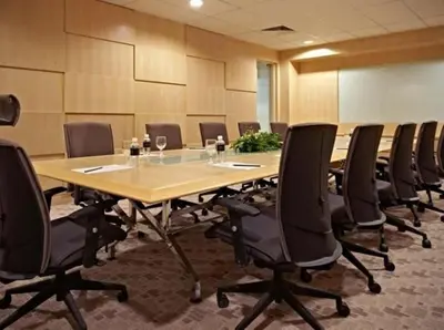 a conference room with a long table and chairs at Premiera Hotel Kuala Lumpur in Kuala Lumpur
