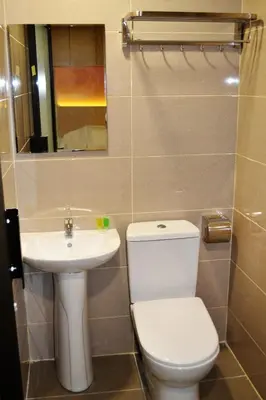 a bathroom with a toilet and a sink at Sky Hotel @ Pudu in Kuala Lumpur