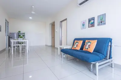a living room with a blue couch and a table at PV21 Setapak, Wangsamaju, Melawati, 15min to KLCC B36a in Kuala Lumpur