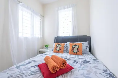 a bedroom with a bed with orange towels on it at PV21 Setapak, Wangsamaju, Melawati, 15min to KLCC B36a in Kuala Lumpur