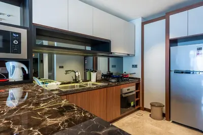 a kitchen with a sink and a counter top at Anggun Residences Luxe in Kuala Lumpur