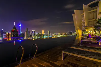 a view of a city skyline at night at Maxhome@Regalia suite residence. KL in Kuala Lumpur
