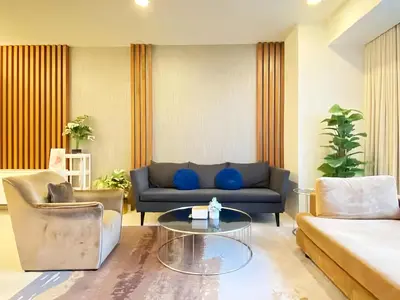 a living room with a couch and a table at Tropicana The Residence KLCC in Kuala Lumpur