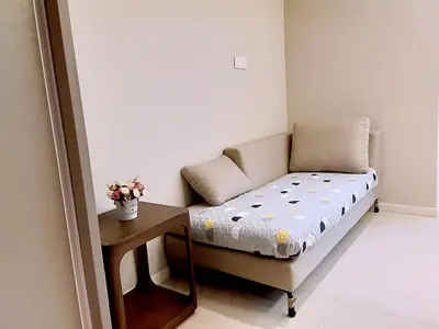 a small room with a couch and a table at Dorsett Residences Sri Hartamas KL in Kuala Lumpur