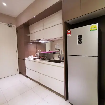 a kitchen with a white refrigerator and a sink at SKY POOL Luxury Suite 2-4Pax at KL City in Kuala Lumpur