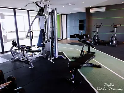 a gym with several treadmills and cardio machines at SKY POOL Luxury Suite 2-4Pax at KL City in Kuala Lumpur